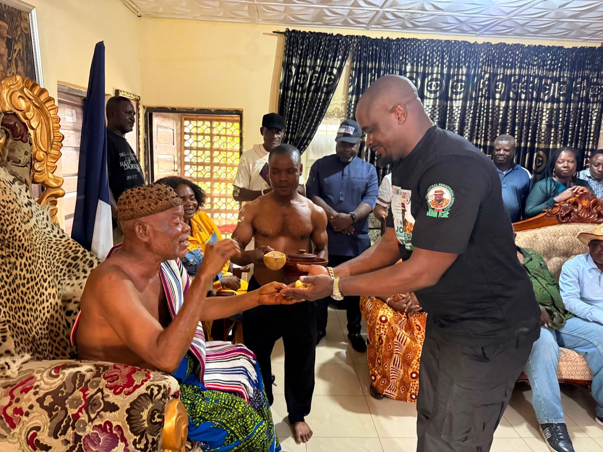 John Ifere presenting a gift to a traditional ruler