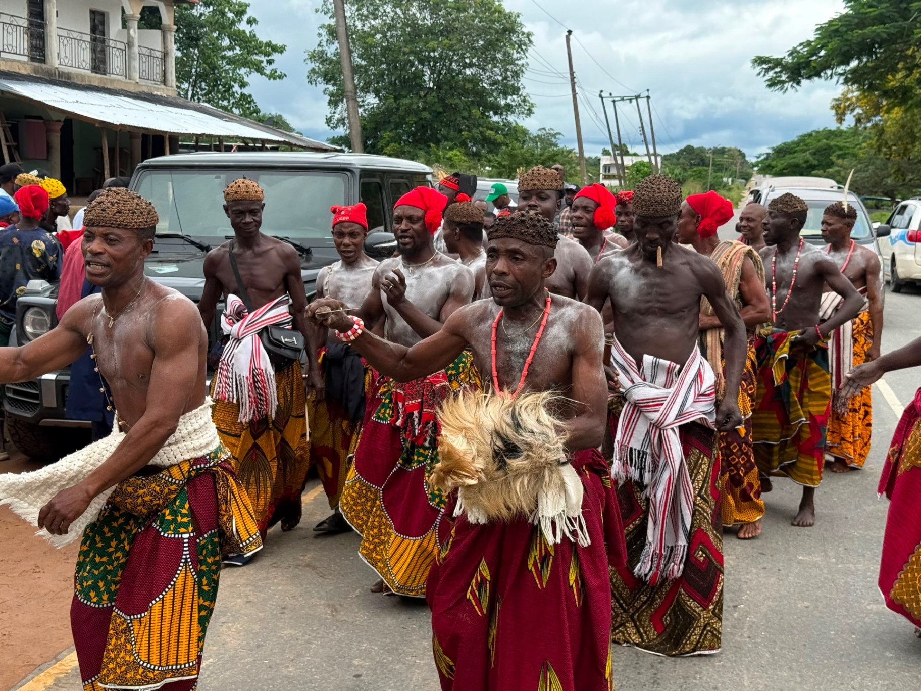 Traditional cultural dancers welcoming John Ifere